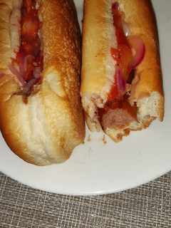 A picture of Choma sauce/Ketchup hot dogs.