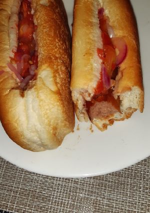 A picture of Choma sauce/Ketchup hot dogs.