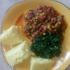 A picture of Fried Liver,Ugali and Sukuma wiki.