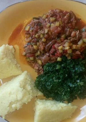 A picture of Fried Liver,Ugali and Sukuma wiki.