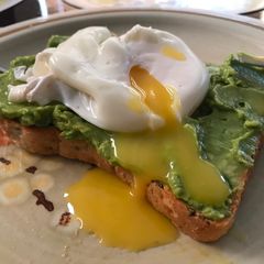 A picture of Poached egg on avocado toast.