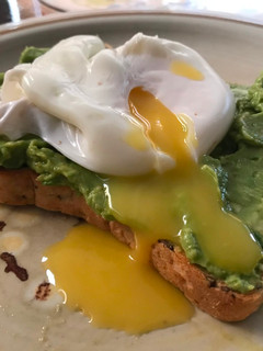 A picture of Poached egg on avocado toast.