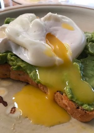 A picture of Poached egg on avocado toast.