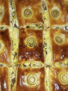 صورة لوصفة كوكا بالعجينة المورقة