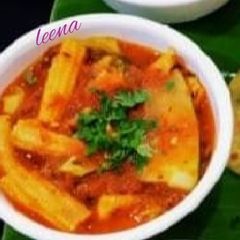 A picture of Broccoli BABY CORN ZUCCHINI IN RED CAPSICUM (Bellpeppers)GRAVY.