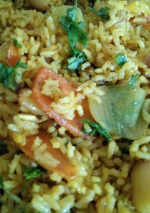 A picture of Biryani (rice with spices and vegetables).