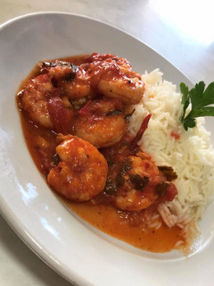 A picture of Shrimp with Red Sauce and Pilaf.