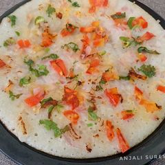 A picture of Onion & Tomato Uttapam.