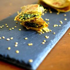 A picture of Spinach stuffed avocado wrap .
