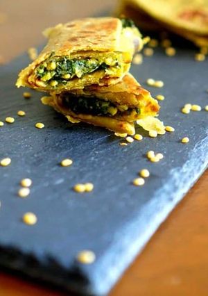 A picture of Spinach stuffed avocado wrap .