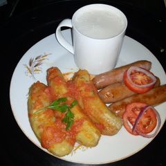A picture of Boiled bananas in tomatoes.