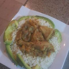 Basmati rice with avacado and tomato stew A picture of Basmati rice with avacado and tomato stew.