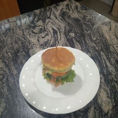 A picture of Caramelized onions chicken burger.