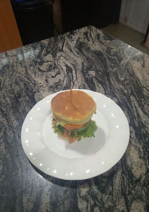 A picture of Caramelized onions chicken burger.