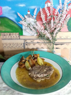 Una foto de Filete al perejil con papas rústicas