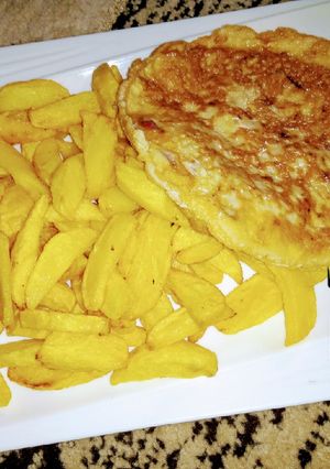 A picture of Chips with fry egg.