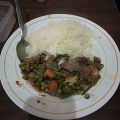 A picture of Buttered rice and stew.