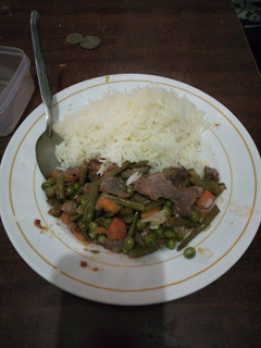A picture of Buttered rice and stew.