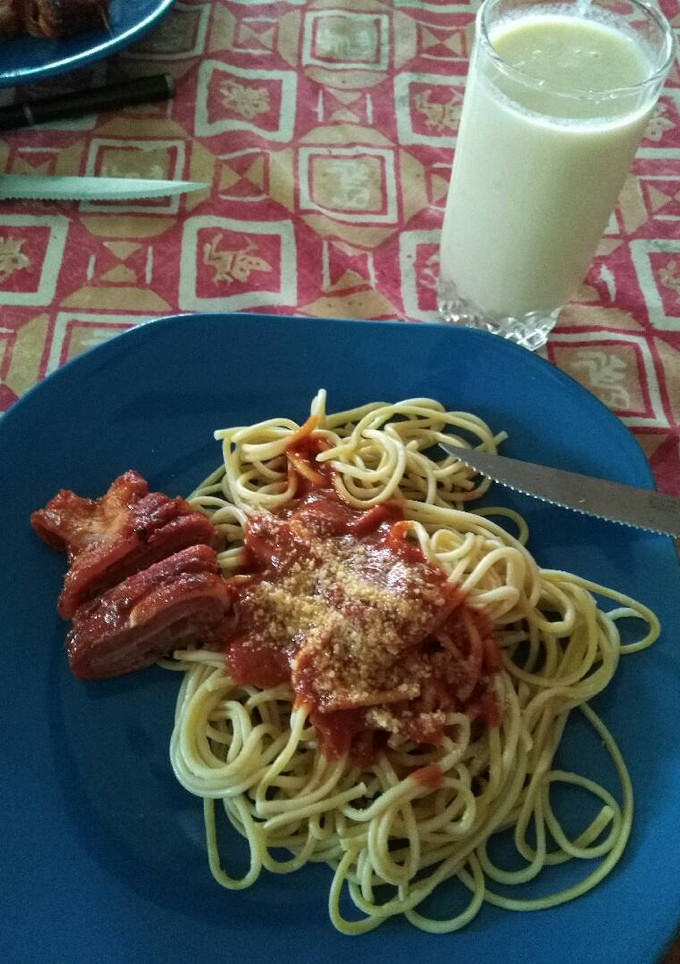 Una foto de Niño envuelto con pasta parmesana
