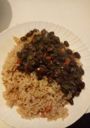 A picture of Fried Rice with black eyed peas.