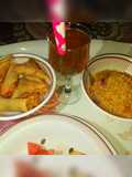 Indomie, spring rolls and samosa, fruit and special drink