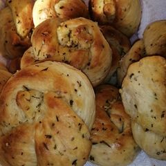 A picture of Garlic and herbs knotted rolls.