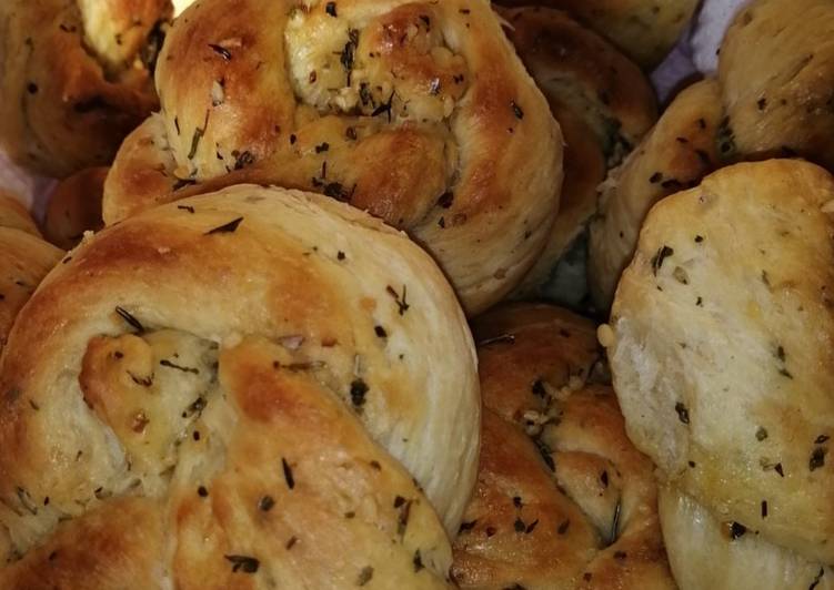 Steps to Make Speedy Garlic and herbs knotted rolls