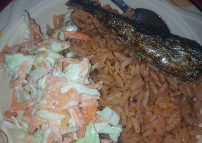 Jollof rice with fried fish and coleslaw