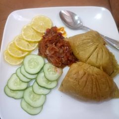 A picture of Moi moi with onions sauce.