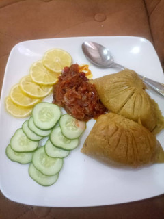 A picture of Moi moi with onions sauce.