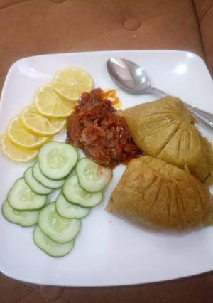 A picture of Moi moi with onions sauce.