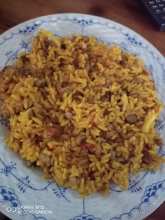 A picture of Jollof rice and beans.