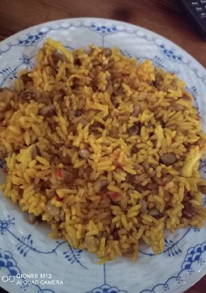 A picture of Jollof rice and beans.