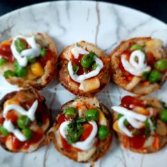 A picture of Raw potato veggies cup in Appe pan.
