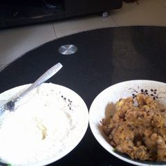 A picture of Plantain and beans porriage with garri and milk.