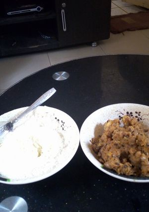 A picture of Plantain and beans porriage with garri and milk.
