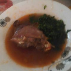 A picture of Stewed Chicken with Saute Kale.