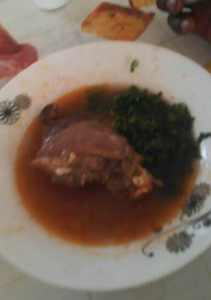 A picture of Stewed Chicken with Saute Kale.