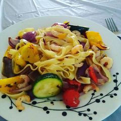 A picture of Pasta with Roasted vegetables and prawns.