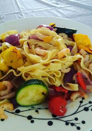 A picture of Pasta with Roasted vegetables and prawns.