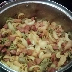 A picture of Kielbasa and noodles.