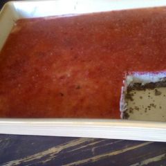 A picture of Vanilla Cheesecake with Strawberry Purée Topping.