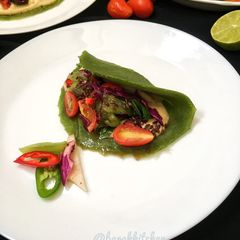 A picture of Spinach pancake with spicy salad.