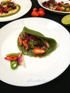 A picture of Spinach pancake with spicy salad.