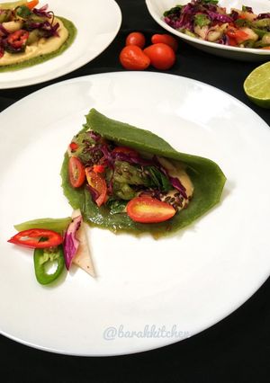 A picture of Spinach pancake with spicy salad.