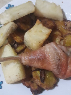 A picture of Crispy yam, fried plantain and a chicken.