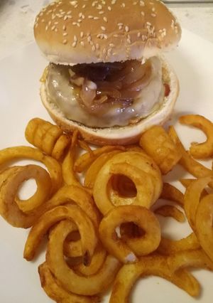 A picture of Burger with scamorza, pancetta and caramelised onions.