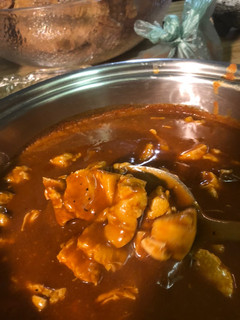 Una foto de Mole Rojo con Carne de Puerco