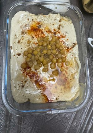 A picture of Chickpea Fatteh (Fatteh Hummus) with Clarified Butter.
