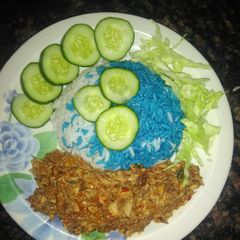 A picture of Blue rice with fish source.